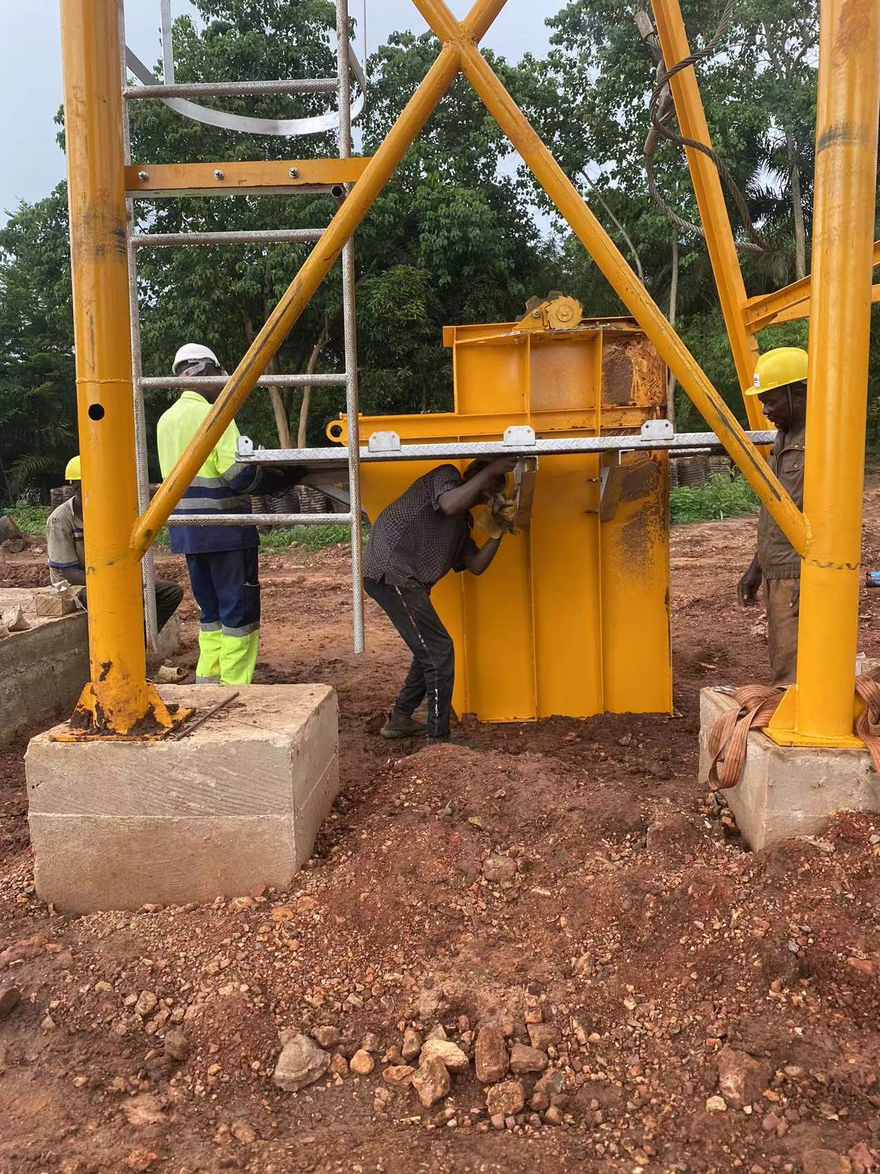 Staff installs asphalt plant support rack details