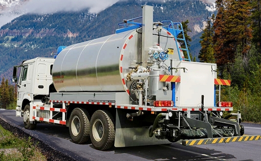 What issues should we pay attention to when working with asphalt spreading trucks?